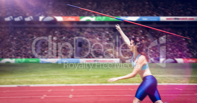 Composite image of profile view of sportswoman is practising javelin throw