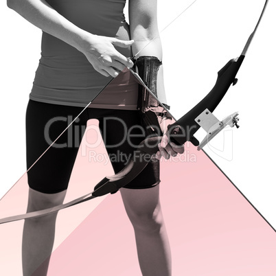 Composite image of focus on sportswoman holding an bow