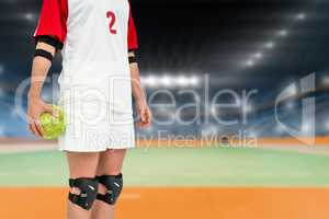 Sportswoman holding a ball