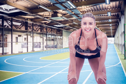 Female athlete with hands on knees