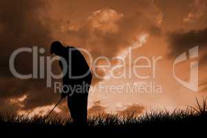 Composite image of golfplayer about to swing a golf ball