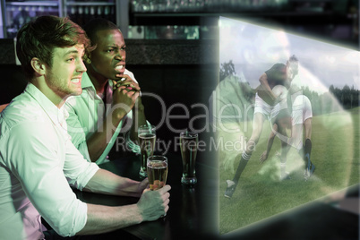 Composite image of friends are watching rugby match