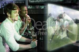 Composite image of friends are watching rugby match