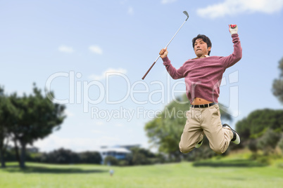 Man jumping with golf club