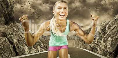 Composite image of portrait of sportswoman smiling and raising a