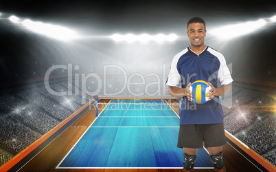 Composite image of sportsman holding a volleyball