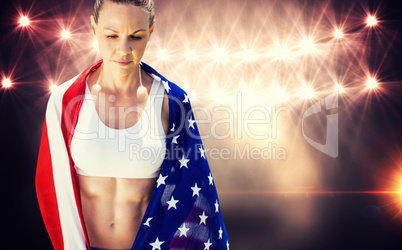 Portrait of american sportswoman unsmiling  against flash light