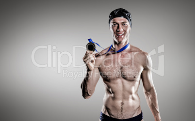 Composite image of swimmer showing his gold medal