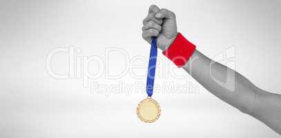 Athlete holding gold medal after victory