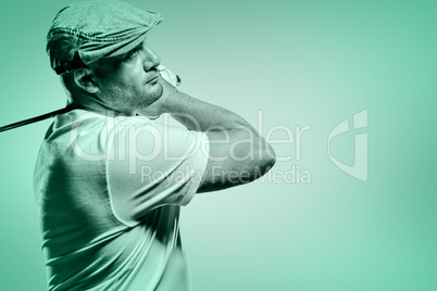 Portrait of golf player taking a shot