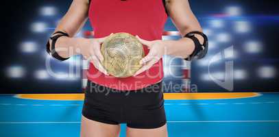 Composite image of female athlete with elbow pad holding handbal