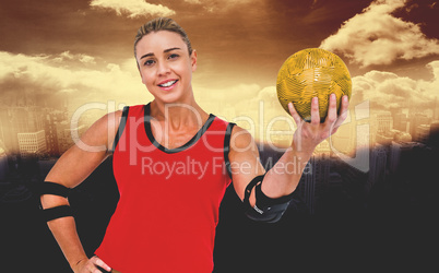 Composite image of female athlete with elbow pad holding handbal