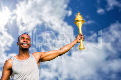 Composite image of front view of happy sportsman holding a cup