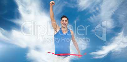Composite image of portrait of cheerful winner athlete crossing