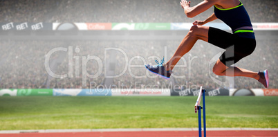 Composite image of cropped image of woman practicing show jumpin