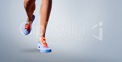 Composite image of close up of sportsman legs walking on a white