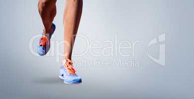 Composite image of close up of sportsman legs walking on a white