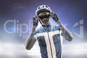 Composite image of cyclist is posing
