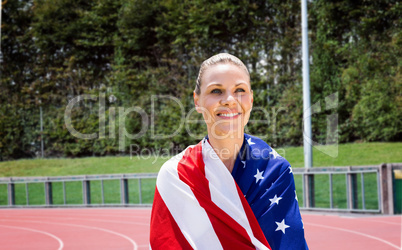 Composite image of portrait of american sportswoman is smiling