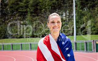 Composite image of portrait of american sportswoman is smiling