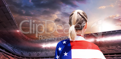 Composite image of rear view of american sportswoman is posing