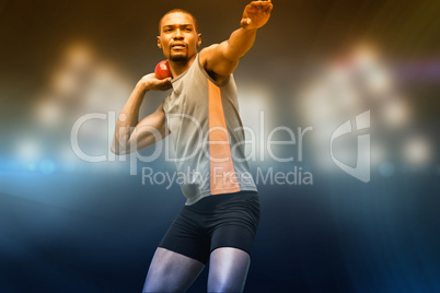 Composite image of front view of sportsman practising shot put