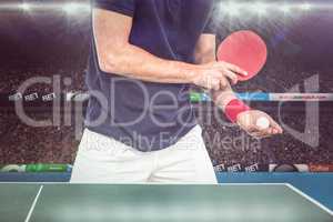 Composite image of mid section of athlete man playing table tenn