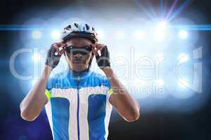 Composite image of cyclist is posing