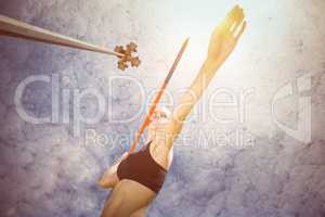 Composite image of sporty woman preparing her javelin throw
