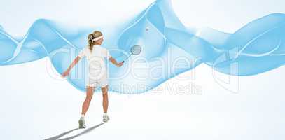 Composite image of sportswoman is playing badminton