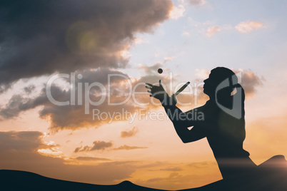 Composite image of female athlete playing ping pong