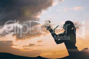 Composite image of female athlete playing ping pong