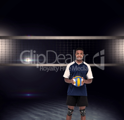 Composite image of sportsman holding a volleyball