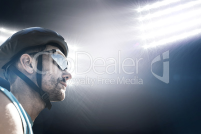 Composite image of man wearing a helmet