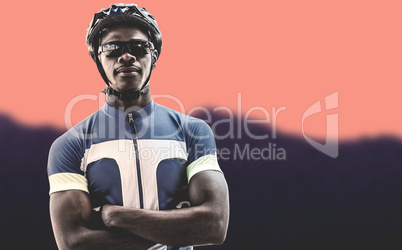 Composite image of cyclist crossing his arms