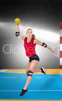 Composite image of female athlete with elbow pad throwing handba