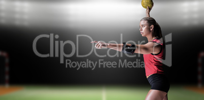 Female athlete with elbow pad throwing handball