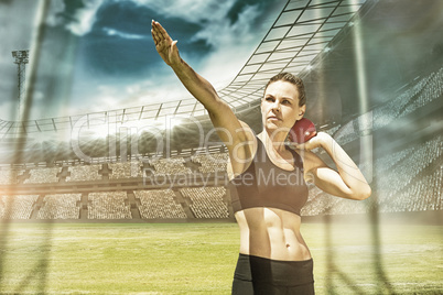 Composite image of sportswoman practising the shot put