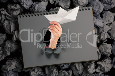 Composite image of cropped hand gesturing little sign