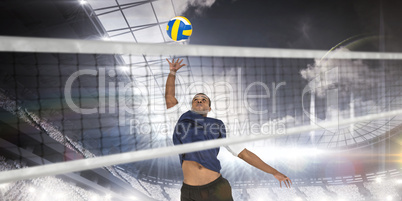 Composite image of sportsman posing while playing volleyball