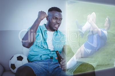 Composite image of football player in blue lying injured on the