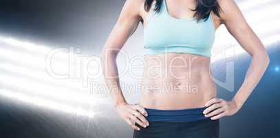 Composite image of portrait of sportswoman chest is posing