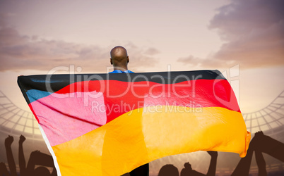 Composite image of rear view of sportsman is holding a German fl