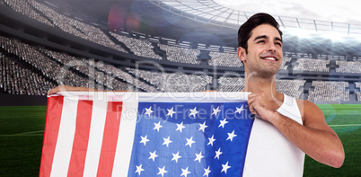 Composite image of athlete posing with american flag