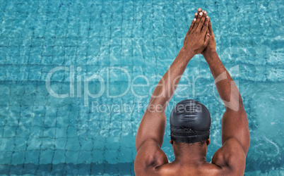 Composite image of rear view of swimmer ready to dive