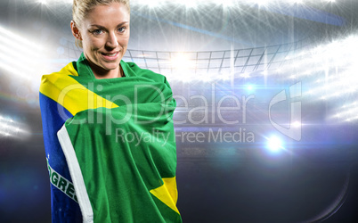 Athlete with brazilian flag wrapped around his body against amer