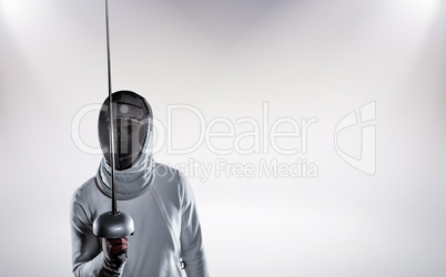 Composite image of man wearing fencing suit practicing with swor