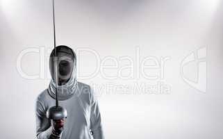 Composite image of man wearing fencing suit practicing with swor