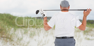 Composite image of rear view of golf player holding a golf club