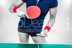 Composite image of female athlete playing ping pong